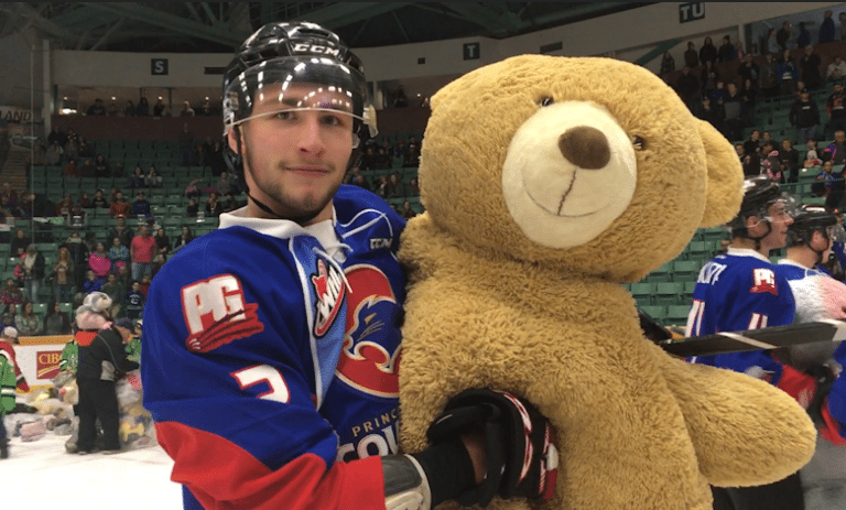 Cougars fans threw stuffed animals, winter clothing onto the ice during Teddy Bear Toss game