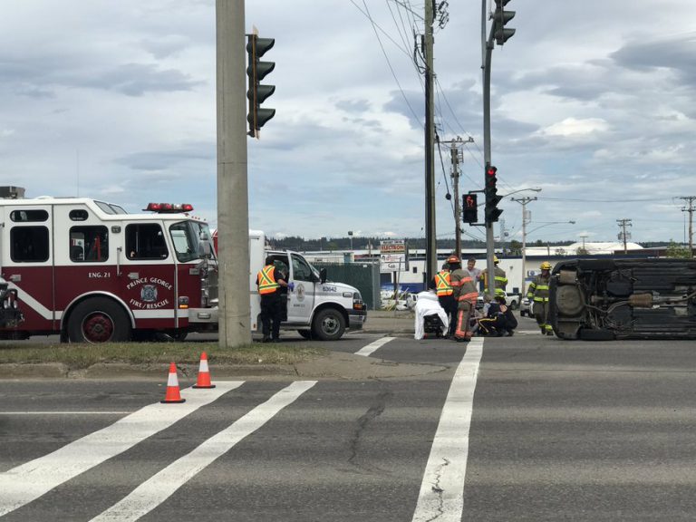 Vehicle flipped on its side at Massey and Ospika